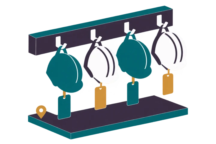 Four safety helmets on hooks with blank coloured tags